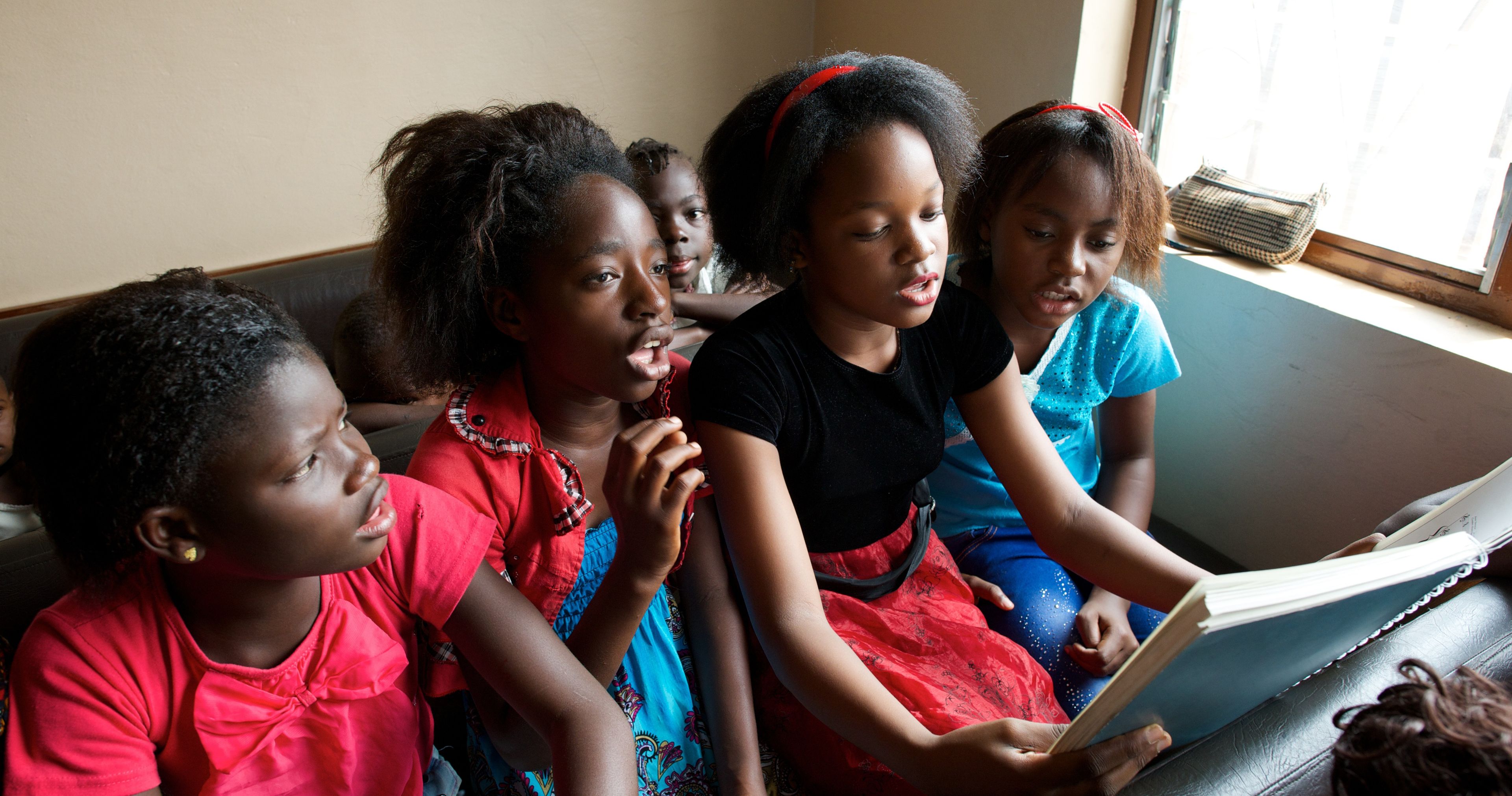 Primary children singing in class.