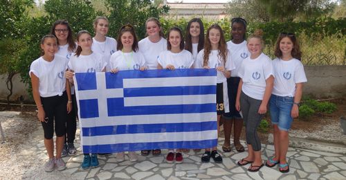 young women holding flag