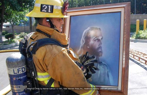 Firefighter with painting of the Savior