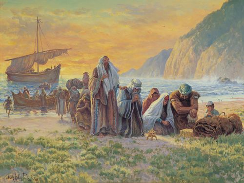 Lehi’s family kneeling on the beach