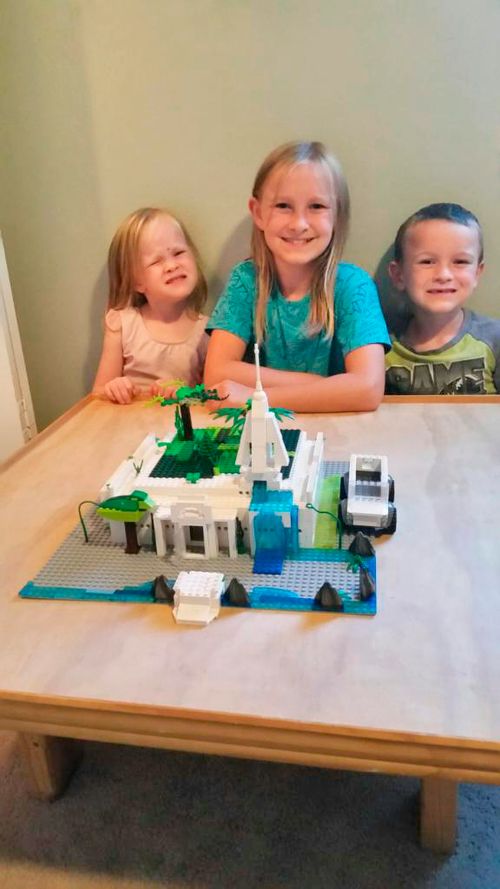 Quick Family Children with their Lego temple