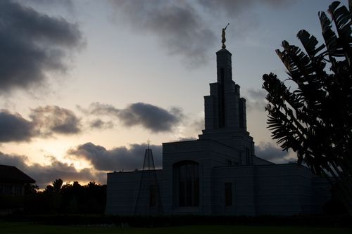 The exterior of the Accra Ghana Temple silhouetted in the late evening.