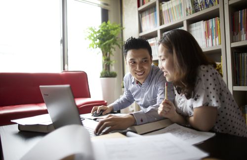 couple in front of laptop computer