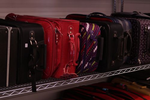 Image of used suitcases for sale at the Ammon Idaho Deseret Industries store.