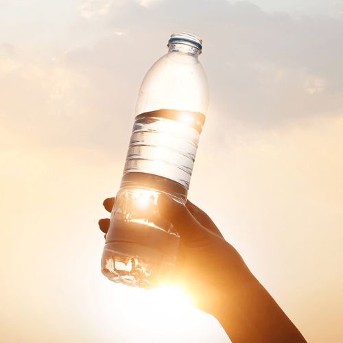 water bottle being held in the air