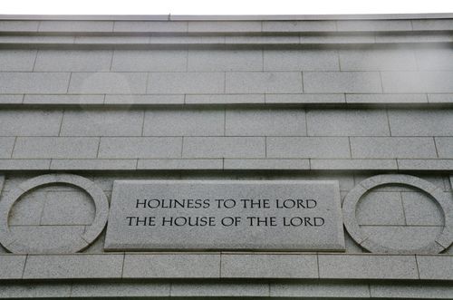 A detail from the Fresno California Temple, with the words “Holiness to the Lord: The House of the Lord” etched in the granite between two rings.