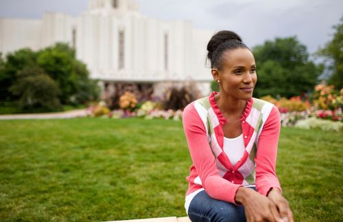 woman sitting in front of the temple