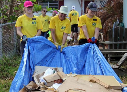 volunteers cleaning up debris