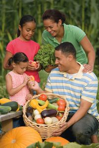 family with garden produce