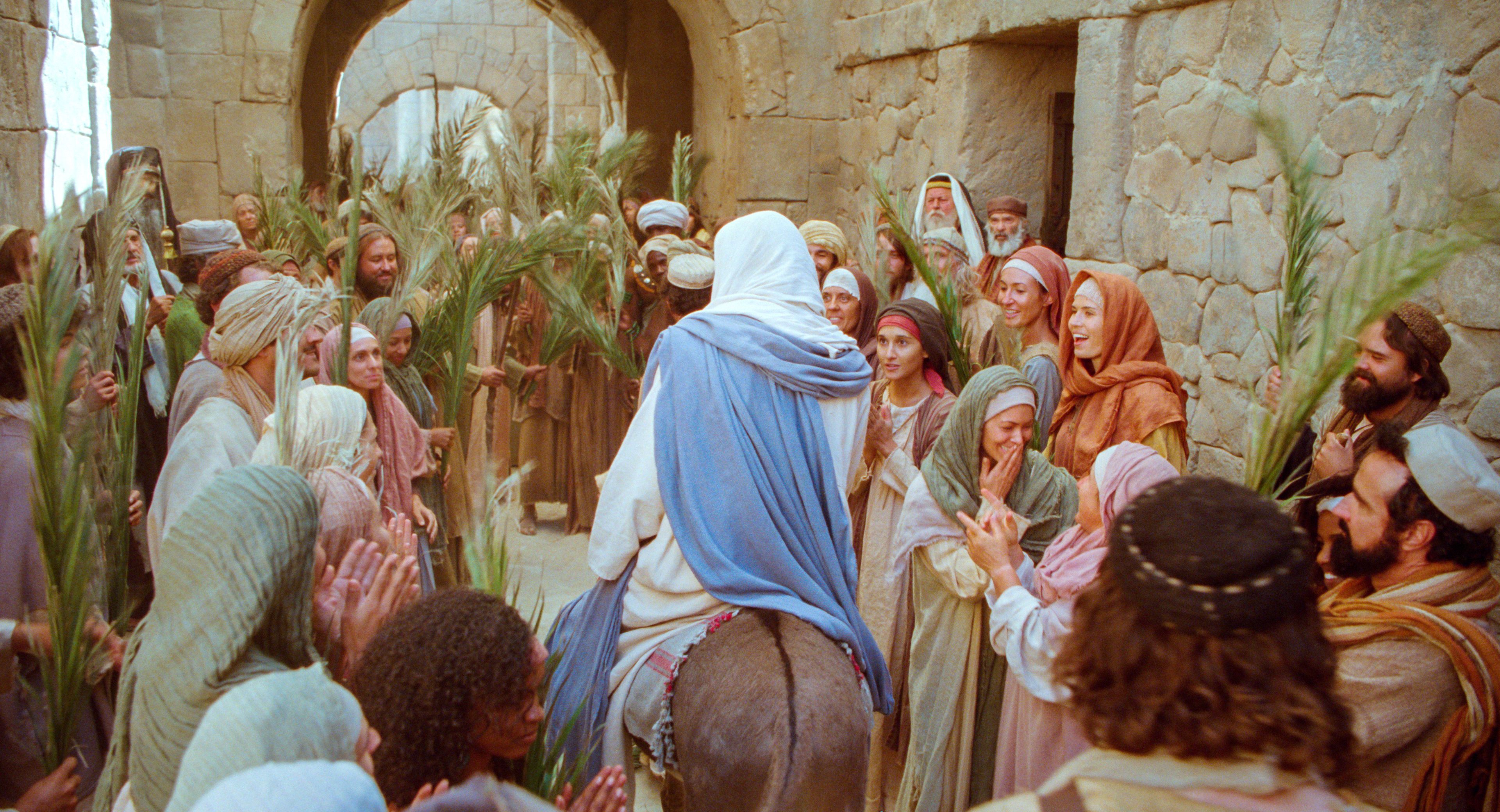 As Jesus walks through the crowds that greet him, they shout hosanna.