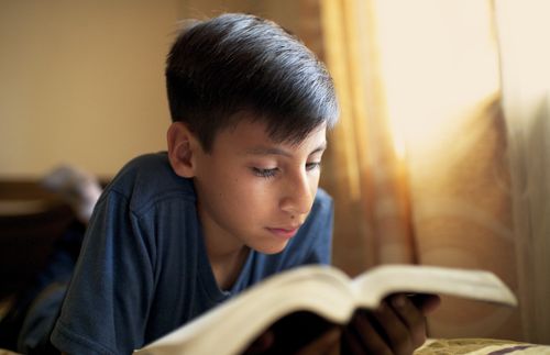 boy reading scriptures