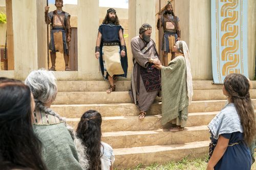 King Benjamin greets the Nephites on the steps of the temple in the Land of Zarahemla.