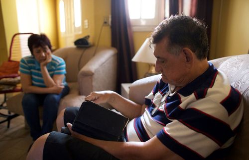 Blanca and her husband reading scriptures