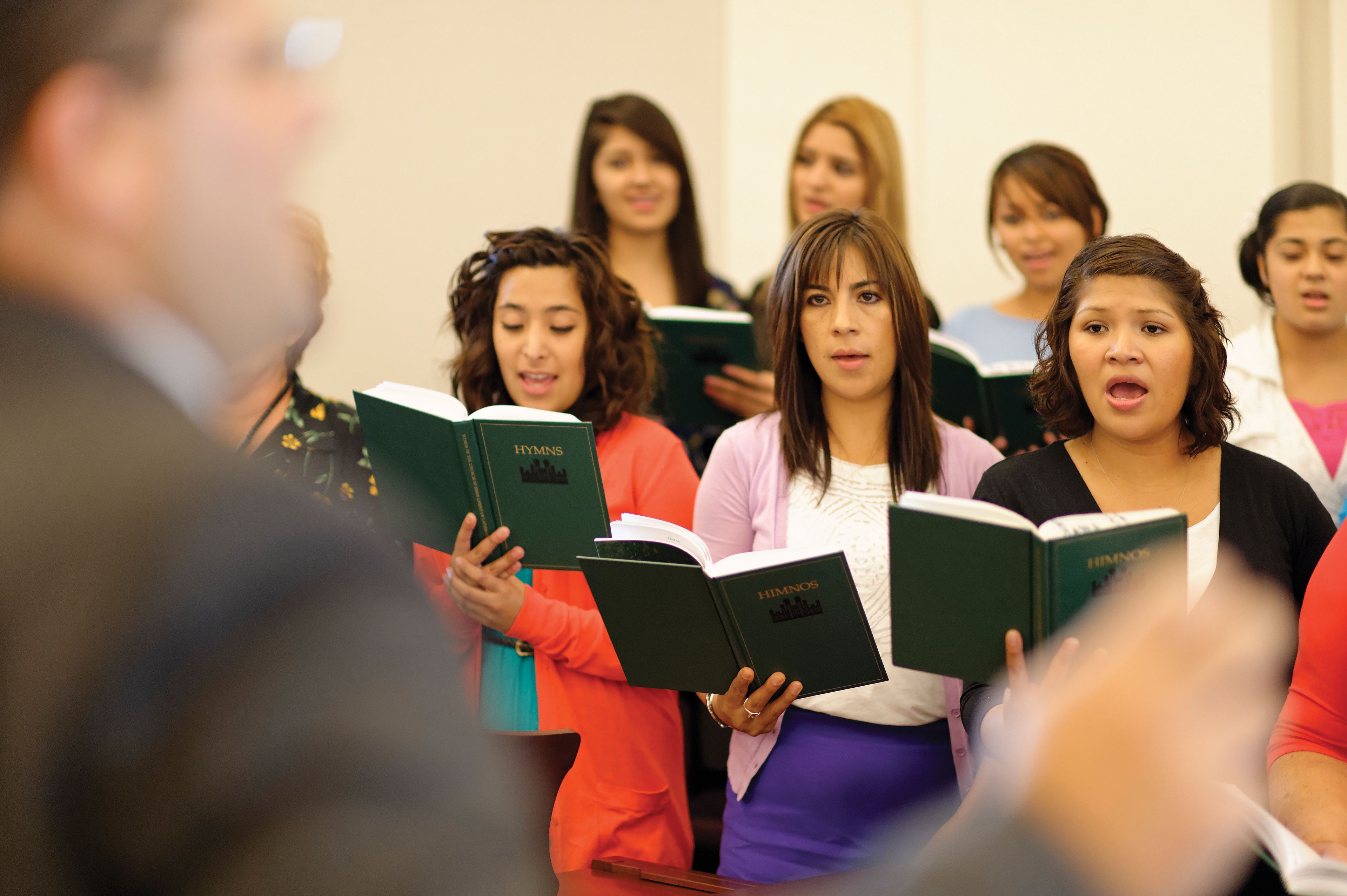 A ward choir sings in a chapel.