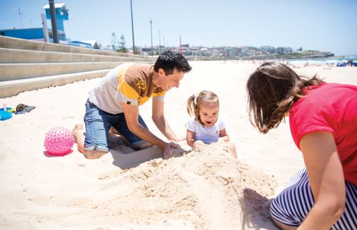 Darren and Stacey with daughter at the beach