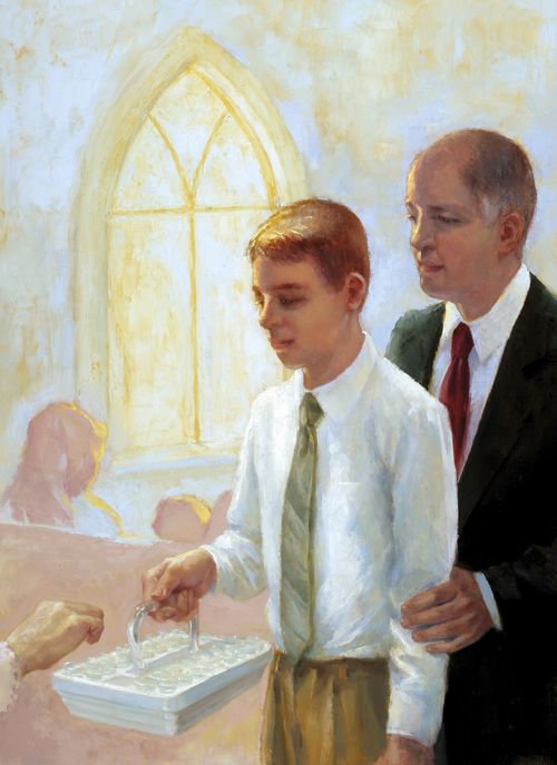 father helping son pass the sacrament