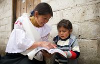 woman reading to child