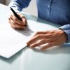 woman signing a document