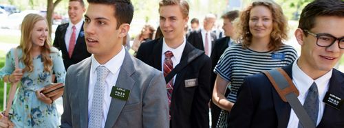 Various missionaries walk the grounds of the Provo Missionary Training Center.