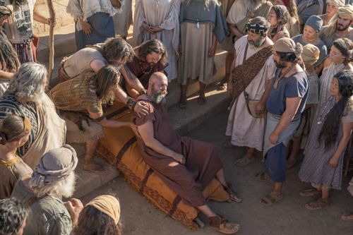 Nephites carry Sherem after he was struck down as a sign from God.