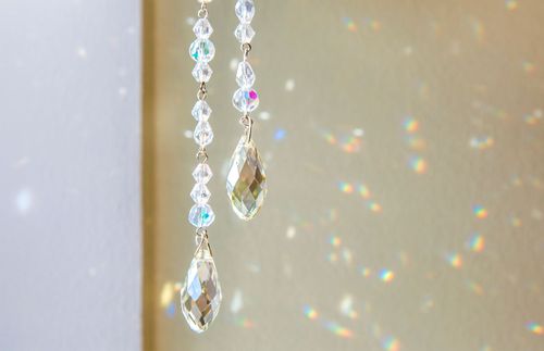 light shining through hanging crystals