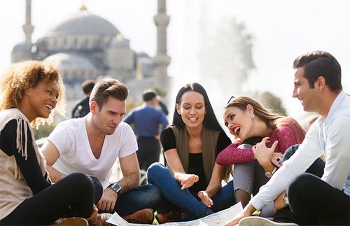 Youth sitting in front of a mosque