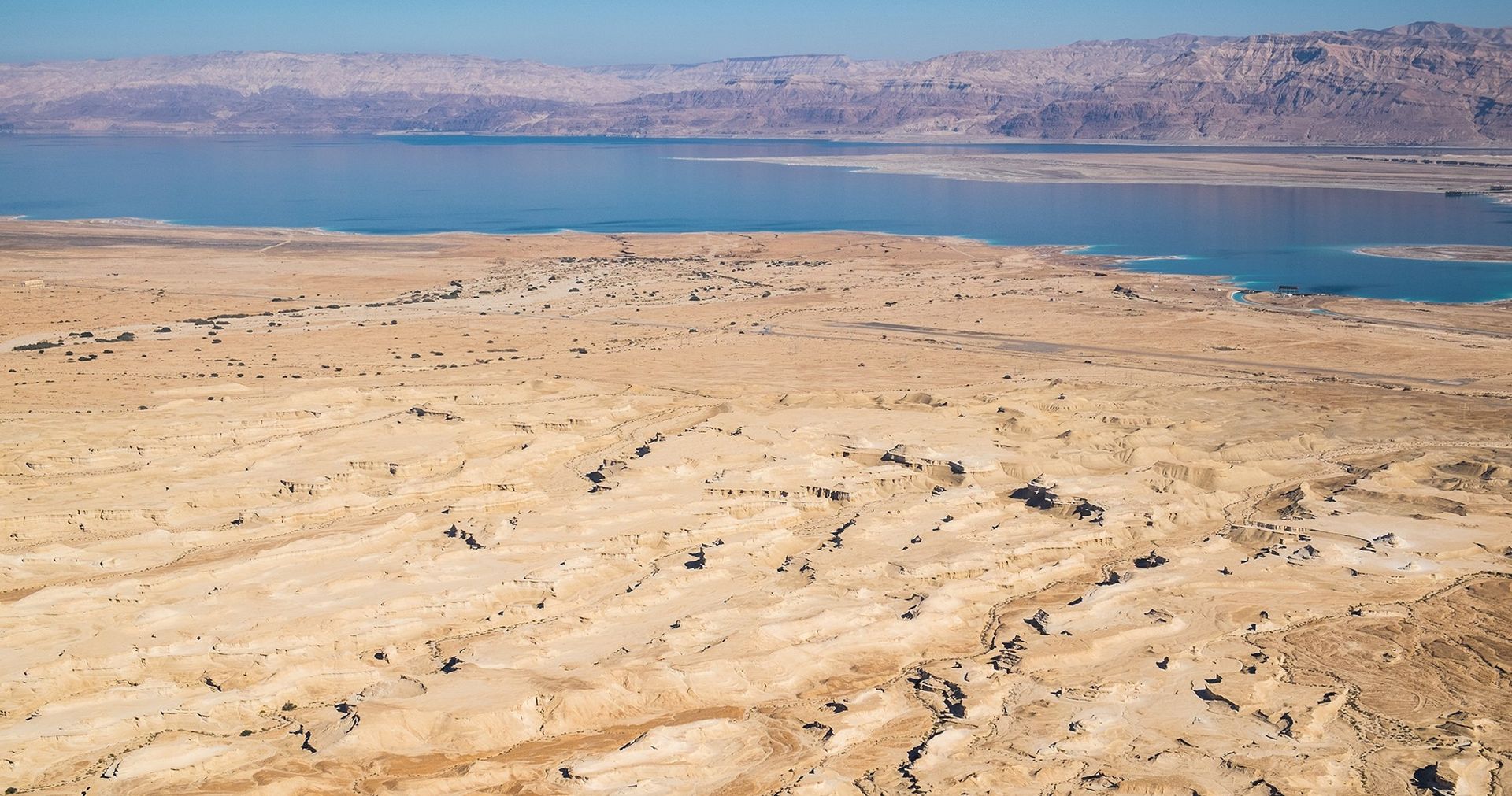 A view of the Israeli desert and the Dead Sea in the distance.