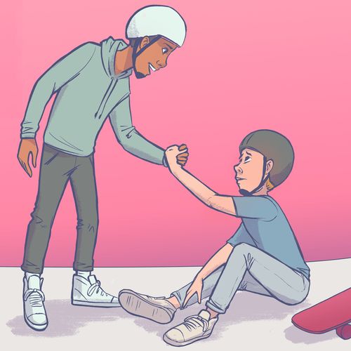 a boy helping another boy up after he has fallen from his skateboard