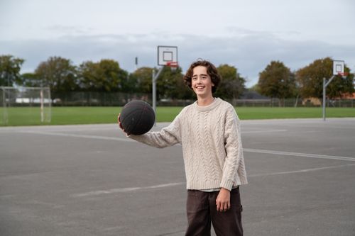 boy playing basketball