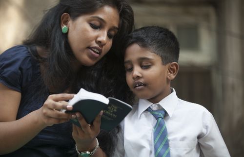 mother and son reading scriptures