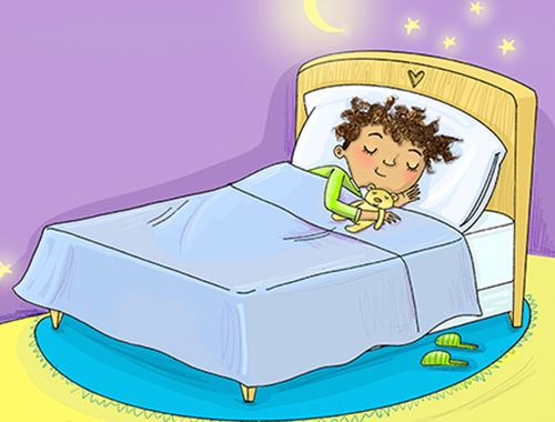 child sleeping in bed