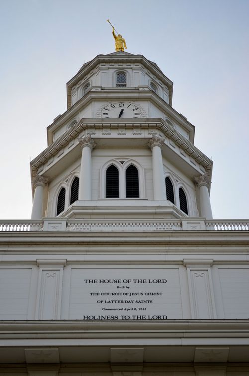 The spire on the Nauvoo Illinois Temple, topped with a clock and the words “Holiness to the Lord: The House of the Lord.”