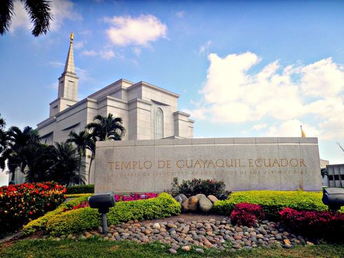 The name sign of the Guayaquil Ecuador Temple surrounded by flowers, rocks, and bushes.