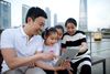 family looking at tablet