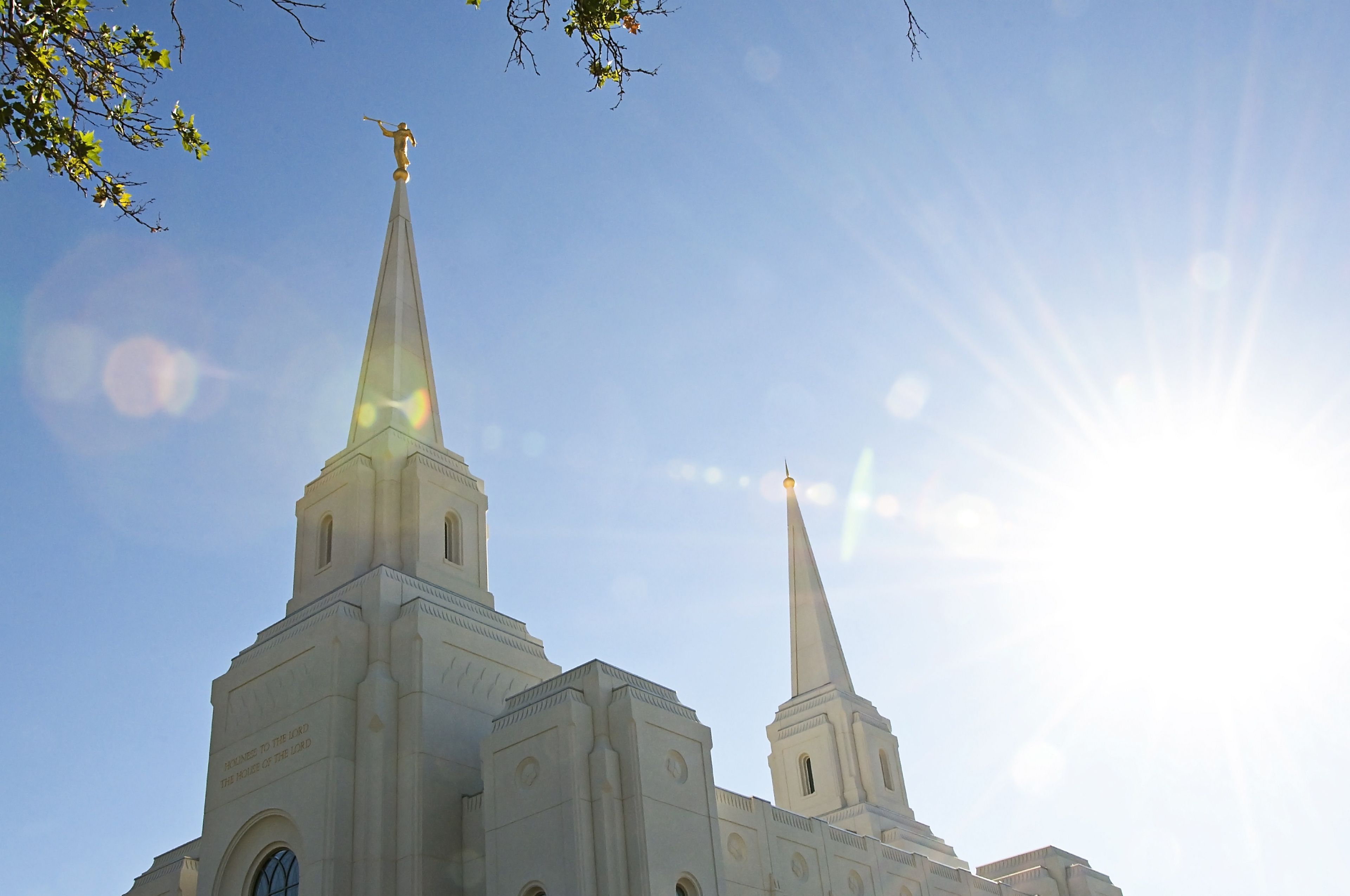 The Brigham City Utah Temple spires in sunlight, including the exterior of the temple.