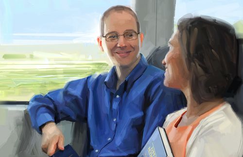 man and woman sitting on train