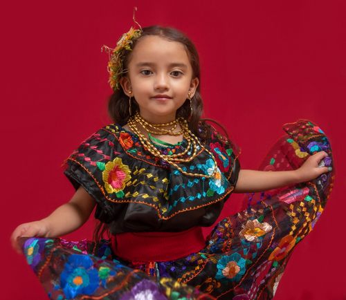 girl wearing brightly colored dress