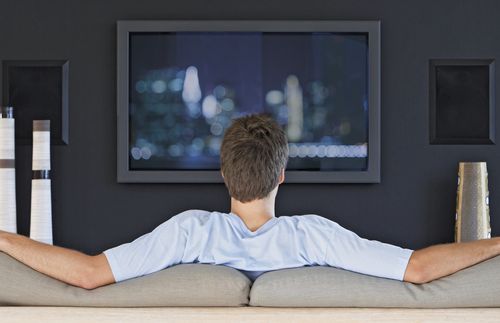 young man watching television