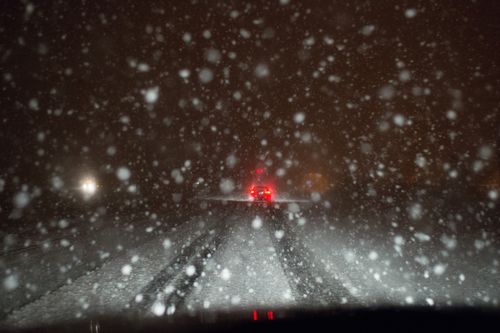 snowy road at night