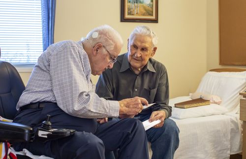 elderly men talking