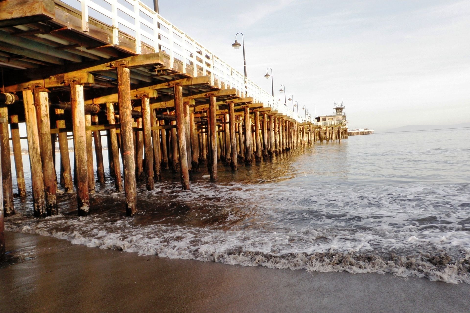 A wooden pier extends out into the water.