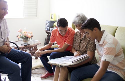 family looking at book