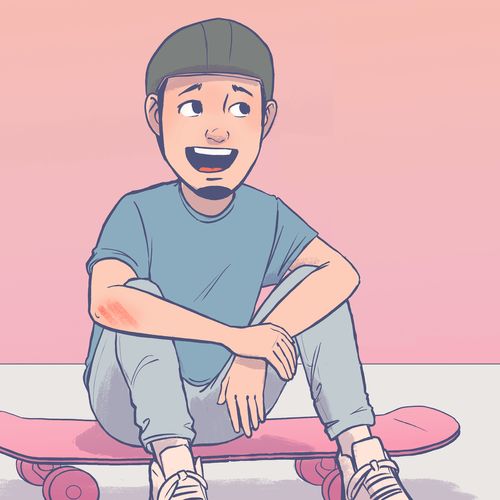 boy sitting on a skateboard