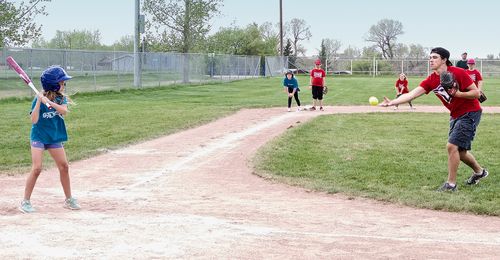 family playing baseball