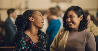 two people talking at church