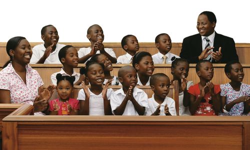 children and teachers in chapel