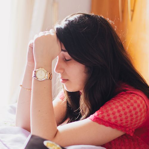 young woman praying