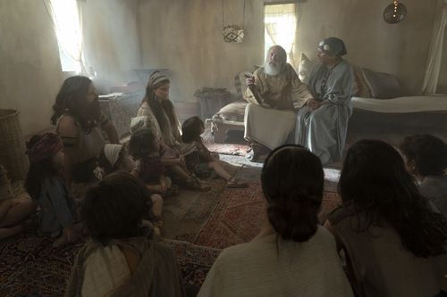 Lehi and Sariah teach their family in their home.