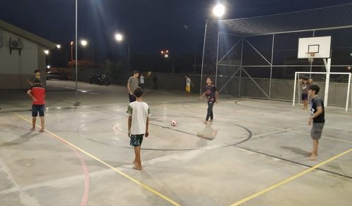 youth playing soccer outside