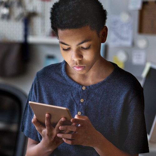 young man reading tablet